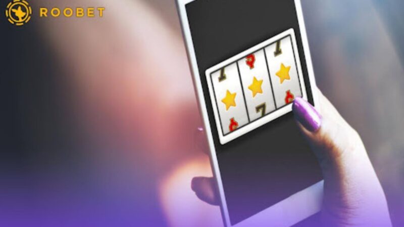 An image of a person playing games on a smartphone